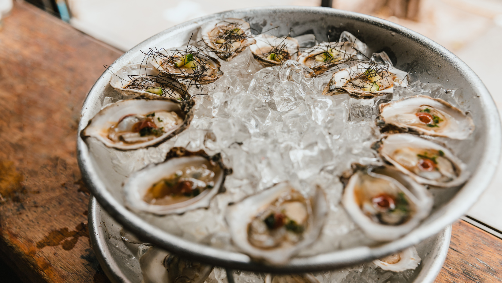 Close-up of fresh oysters on the half shell with lemon slices